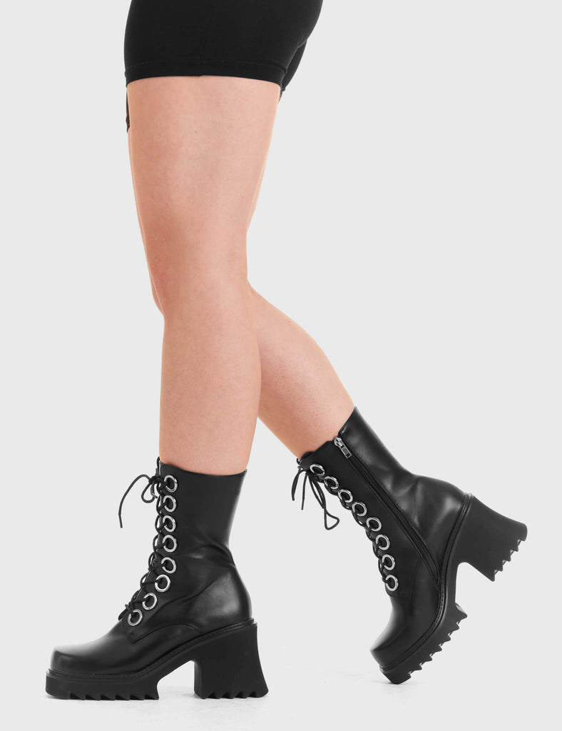 LACED UP Bulletproof Chunky Platform Ankle Boots in black. These vegan western Boots feature black laces and a shark teeth grip sole, very chic. Made with eco-friendly materials and 100% cruelty-free, these boots are as ethical as they are edgy! - Chunky Platform - Calf length - Shark teeth grip - black laces - Silver eyelets - Rounded toe - 100% vegan SKU: LMF 3731 BLACK