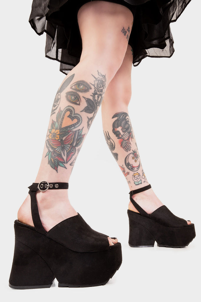 FOREVER! Everlong Chunky Platform Sandals in Black faux leather. These sandals feature an adjustable ankle strap with silver eyelets and a 'O' ring shaped buckles, infuse the charm and leave a lasting impression with these on these suede platform wedge sandals, Made with eco-friendly materials and 100% cruelty-free. 100% Vegan. - Platform Height - Heel Height - Adjustable Ankle Strap - Silver Eyelets - 'O' Ring Buckle - Chunky Platform Sole - Open Toe - 100% vegan SKU: LMF 1342 - BlackPU