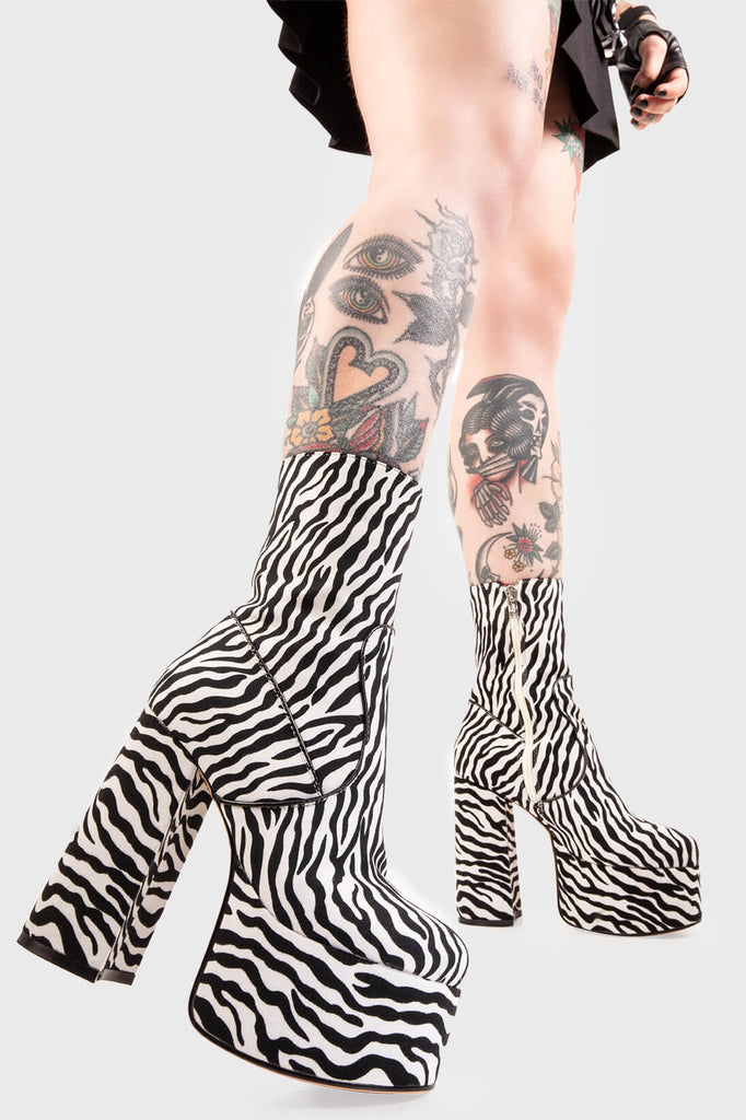 GET WILD WITH IT!  

Adore You Platform Ankle Boots in Zebra Print faux suede. These faux suede vegan Platform Ankle Boots feature a black and white Zebra print design and our High Platform sole, making them the only choice to elevate your look! Made with eco-friendly materials and 100% cruelty-free, these boots are as ethical as they are wild!


- Platform Height: 2.5 inch
- Heel Height: 5.5 inch 
- Mid ankle length 
- White zipper
- High Platform sole
- Round toe 
- 100% vegan 

SKU: LMF 0119 - Zebra