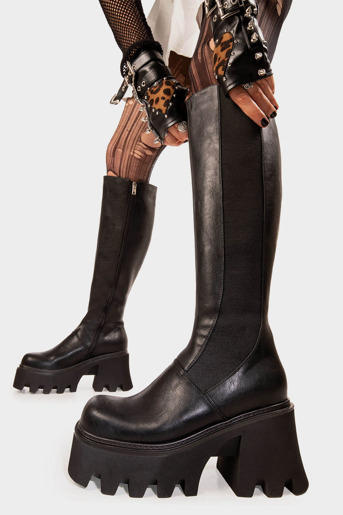 Punk Power
 
 For You Chunky Platform Knee High Boots in Black faux leather. These Black vegan Knee High Boots feature on a chunky platform sole with a stretchy gusset detail, elevate you style. Made with eco-friendly materials and 100% cruelty-free, these boots are as ethical as they are powerful!
 
 
 - Platform Height: 3.3 inch
 - Knee High length
 - Black zipper 
 - Chunky Platform sole
 - Gusset detail
 - Wide calf and ankle friendly
 - Round toe 
 - 100% vegan 
 
 SKU: LMF 1246 - BlackPU