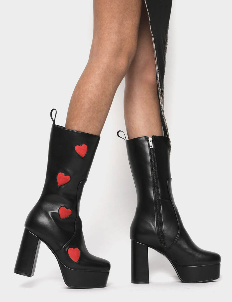 LOVE AT FIRST SIGHT

Game Of Love Platform Calf Boots in Black faux leather. These Black vegan Boots feature our ICONIC Red faux suede hearts and Platform sole and heel, perfect for adding height and style to any outfit. Made with eco-friendly materials and 100% cruelty-free, these boots are as ethical as they are cute!


- Platform Height: 1.25 inch
- Heel Height: 4.2 inch
- Calf High length
- Red Hearts
- Black zipper 
- Platform sole
- Round Toe
- 100% vegan 

SKU: LMF 1213 - BlackPU/RedHeart