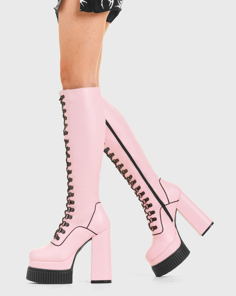 HIGH IN THE SKY
 
 Hidden Agenda Creeper Platform Knee High Boots in Pink faux leather. These vegan western Boots feature a lace up design and Black stitch detailing. Made with eco-friendly materials and 100% cruelty-free, these boots are as ethical as they are trendy!
 
 
 - Heel Height 
 - Knee high length
 - Black stitching
 - Black zip 
 - Rubber grip sole
 - Rounded toe 
 - 100% vegan 
 
 SKU: LMF 3968 - PinkPU