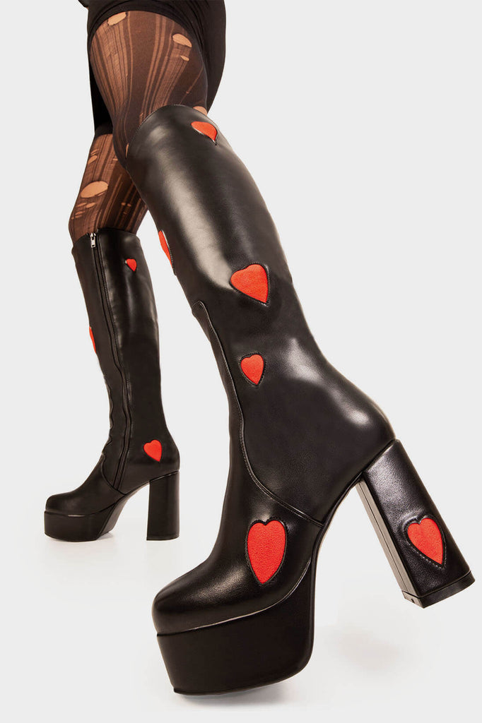 THE ONE FROM INSTA'
 
 Jam Tarts Wide Calf Platform Knee High Boots in Black faux leather. These Black vegan Boots feature our ICONIC Red faux suede hearts and Platform sole and heel, perfect for adding height and style to any outfit. Made with eco-friendly materials and 100% cruelty-free.
 
 
 - Platform Height:
 - Heel Height:
 - Knee High length
 - Wide fit
 - Red Hearts
 - Black zipper 
 - Platform sole
 - Round Toe
 - 100% vegan 
 
 SKU: LMF 0916 - Black/RedHeart - WIDE FIT