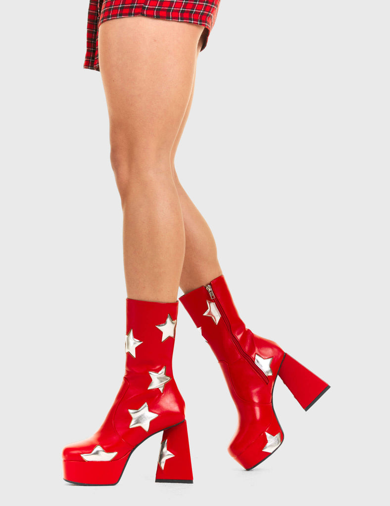 DISCO FEVER 
 
 Seeking Stars Platform Ankle Boots in Red faux leather. These platform boots feature a red boot with silver stars all over. Made with eco-friendly materials and 100% cruelty-free, these platform boots are as ethical as they are chic.
 
 - Platform Height
 - Silver stars
 - Calf length
 - Triangle heel
 - High Heel
 - 100% vegan 
 
 SKU: LMF 3338 - RedPU/SilverStar