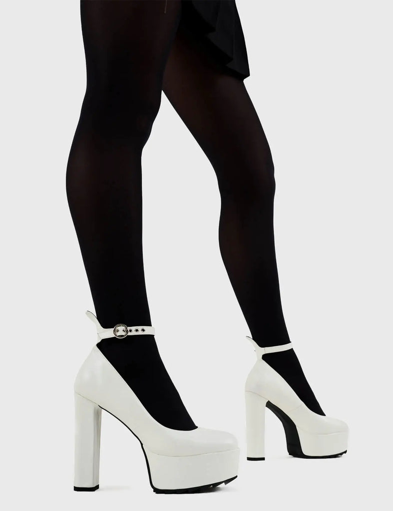 Head over Heels for these! Above Average Platform Heels in White faux leather. These platform heels feature a minimalist design with a thin ankle strap and silver buckle, perfect heels to compliment any outfit. Made with eco-friendly materials and 100% cruelty-free, these platform boots are as ethical as they are trendy. - Platform Height - Heel Height - Think ankle strap with a silver buckle and eyelets - High Heel - Platform sole - 100% vegan SKU: LMF 3100 - WhitePU