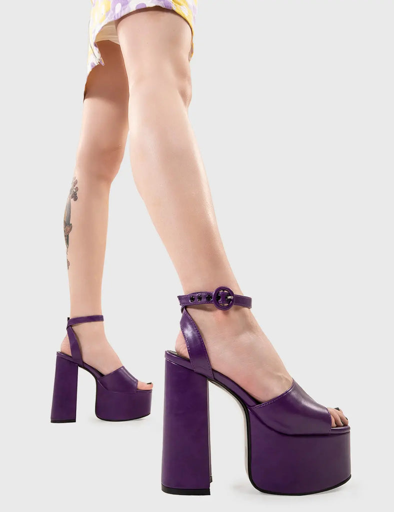 MAKE YOUR STATEMENT All For You Platform Sandals in Purple Pu. These vegan Sandals feature an adjustable ankle strap with a Platform sole and high heel, perfect for adding height and glamour to any outfit. Made with eco-friendly materials and 100% cruelty-free, these Sandals are as ethical as they are hot! - Platform Height: 2.5 inch - Heel Height: 5.5 inch - Open Toe - Wrap around ankle strap - O shaped buckle and silver eyelets - Platform sole - Round toe - 100% vegan SKU: LMS 104 - PurplePU