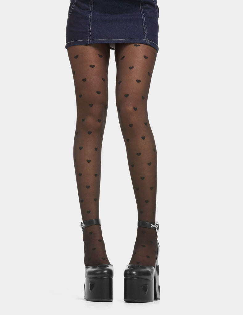 Love Story Sheer Tights in Black. Super stretchy fit, one size fits all! Featuring a classic sheer construction and with Black Hearts throughout.&nbsp;