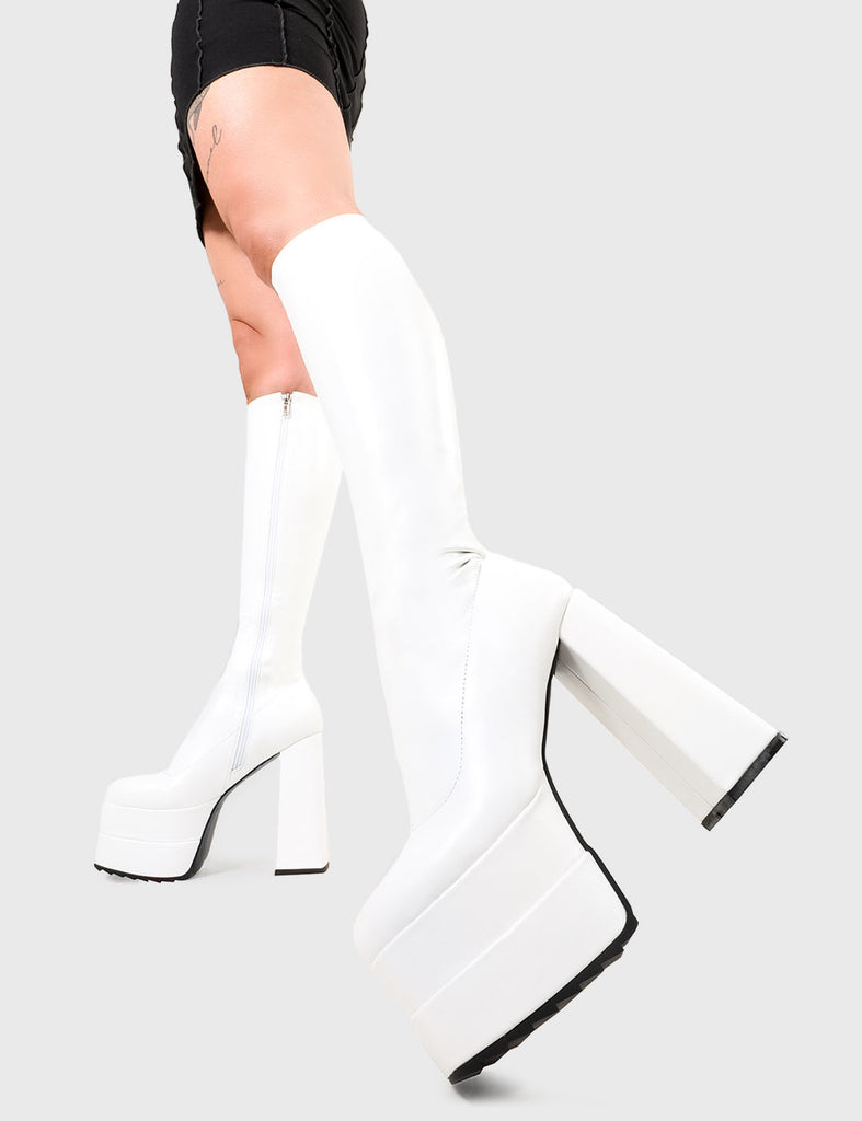 TIKTOK made me buy it! Bad Gurl Platform Knee High Boots in White Stretch faux leather. These platform boots feature on our double stack platform sole, stepping up and standing tall. Made with eco-friendly materials and 100% cruelty-free, these platform boots are as ethical as they are Legendary! - Platform Height - Heel Height - White Zip - Knee high length - Shark's teeth grip - Chunky Platform sole - Round Toe - 100% vegan SKU: LMF 2696 - WhitePU