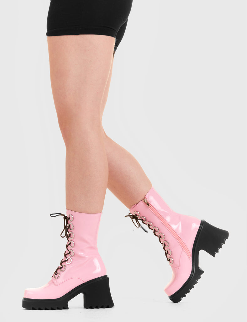 LACED UP Bulletproof Chunky Platform Ankle Boots in Pink Patent. These vegan western Boots feature black laces and a shark teeth grip sole, very chic. Made with eco-friendly materials and 100% cruelty-free, these boots are as ethical as they are edgy! - Chunky Platform - Calf length - Shark teeth grip - black laces - Silver eyelets - Rounded toe - 100% vegan SKU: LMF 3731 PINK