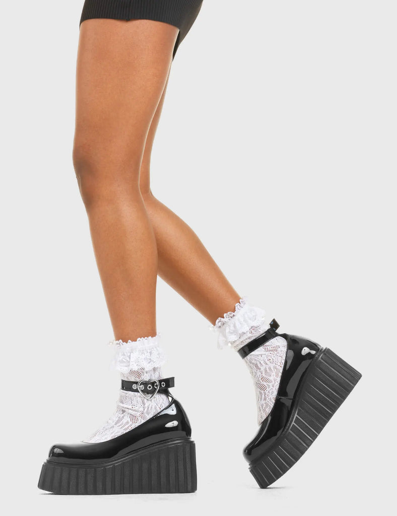 STRAPPED IN Cant Stop Chunky Platform Creeper Shoes in Black patent. These vegan western Boots feature a minimalist design with a silver heart buckle, very classy. Made with eco-friendly materials and 100% cruelty-free, these boots are as ethical as they are edgy! - Chunky Platform - Ankle length - Adjustable straps - Silver heart buckles - Rounded toe - 100% vegan SKU: LMF 3609 - BlackPAT