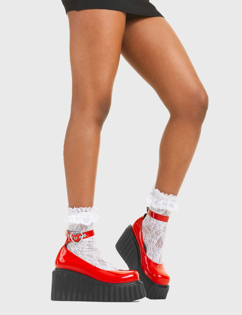 STRAPPED IN Cant Stop Chunky Platform Creeper Shoes in Red patent. These vegan western Boots feature a minimalist design with a silver heart buckle, very classy. Made with eco-friendly materials and 100% cruelty-free, these boots are as ethical as they are edgy! - Chunky Platform - Ankle length - Adjustable straps - Silver heart buckles - Rounded toe - 100% vegan SKU: LMF 3609 - RedPAT