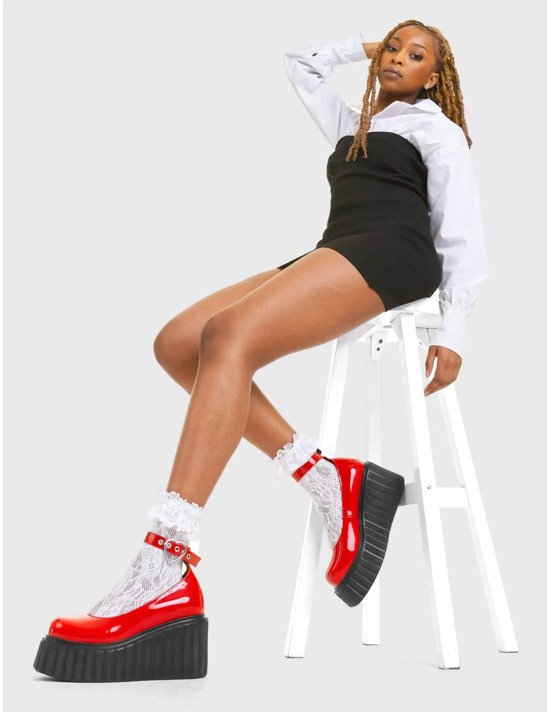 STRAPPED IN Cant Stop Chunky Platform Creeper Shoes in Red patent. These vegan western Boots feature a minimalist design with a silver heart buckle, very classy. Made with eco-friendly materials and 100% cruelty-free, these boots are as ethical as they are edgy! - Chunky Platform - Ankle length - Adjustable straps - Silver heart buckles - Rounded toe - 100% vegan SKU: LMF 3609 - RedPAT