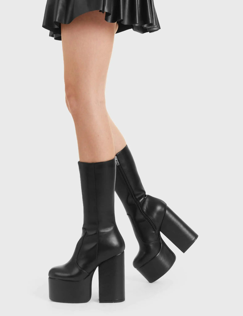 Not Your Basic Boots Circle Of Lies Platform Calf Boots in Black faux leather. These platform boots feature a minimalist design on platform sole, perfect boots to compliment any outfit. Made with eco-friendly materials and 100% cruelty-free, these platform boots are as ethical as they are trendy. - Platform Height - Heel Height - Black zip - Thick High Heel - Platform sole - 100% vegan SKU: LMF 3004 - BlackPU