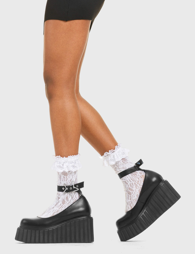 STAR LIGHT DND Chunky Platform Creeper Shoes in Black faux leather. These vegan western Boots feature a minimalist design with a silver star buckle, very classy. Made with eco-friendly materials and 100% cruelty-free, these boots are as ethical as they are edgy! - Chunky Platform - Ankle length - Adjustable straps - Silver star buckles - Rounded toe - 100% vegan SKU: LMF 3608 - BlackPU