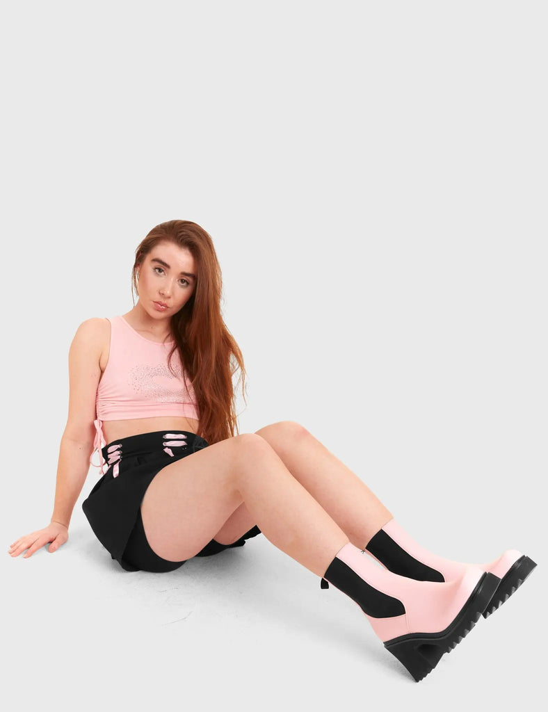 THESE BOOTS ARE MADE FOR WALKING Elevate Chunky Platform Ankle Boots in Pink faux leather. These vegan western Boots feature a black gusset and a shark teeth grip sole, very chic. Made with eco-friendly materials and 100% cruelty-free, these boots are as ethical as they are edgy! - Chunky Platform - Calf length - Shark teeth grip - Black gusset - Rounded toe - 100% vegan SKU: LMF 3728 - PinkPU