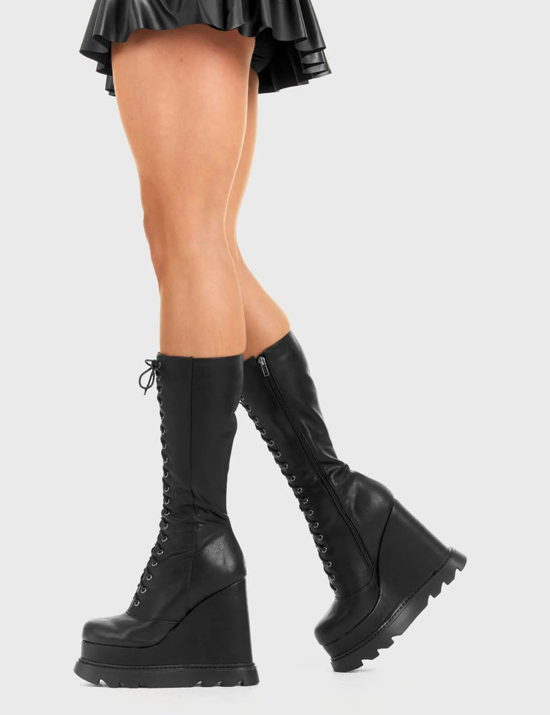 Not Your Basic Boots Empty Space Chunky Platform Calf Boots in Black faux leather. These Black vegan Wedge boots feature a lace-up design on our Platform wedge sole, perfect for adding height and edge to any look. Made with eco-friendly materials and 100% cruelty-free, these boots are as ethical as they are badass! - Platform Height: - Heel Height - lace-up - Black Zip - Wedge sole - Round Toe - 100% vegan SKU: LMF 2941 - BlackPU