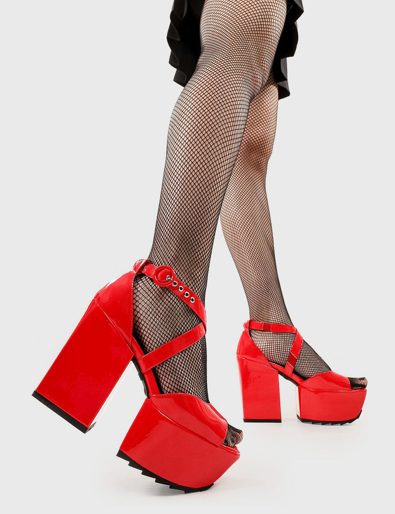 Vacay Vibes Enemies Close Platform Sandals in Red Patent faux leather. These platform sandals feature an adjustable red ankle strap with silver eyelets, your stylish escapes. Made with eco-friendly materials and 100% cruelty-free, these platform boots are as ethical as they are Platform Paradise. - Platform Height - Heel Height - Adjustable red strap - Shark's teeth grip - Silver eyelets with 'O' shaped buckle - Chunky Platform sole - Round Toe - 100% vegan SKU: LMF 2519 - RedPAT