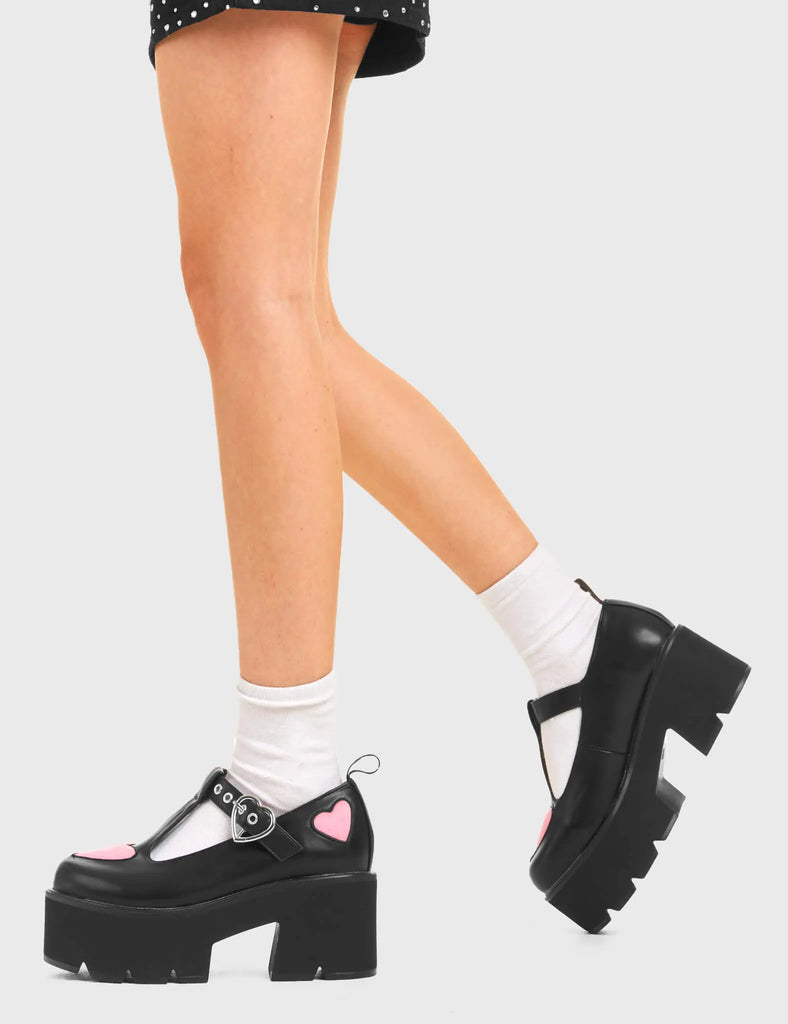 LOVABLE Fairytale Chunky Mary Jane Shoes in Black faux leather. These vegan western Boots feature Pink hearts complimenting the adjustable heart buckled straps, very cute. Made with eco-friendly materials and 100% cruelty-free, these boots are as ethical as they are romantic! - Platformed - Ankle length - Silver heart buckle - Pink hearts - Chunky black sole - Rounded toe - 100% vegan SKU: LMF 3902 - BlackPU/PinkHeart