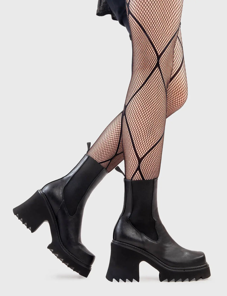 Anything But Basic Fireflies Chunky Platform Ankle Boots in Black faux leather. These platform boots feature an elegant, minimalist design, with an elastic gusset and a chunky sole, the perfect way to elevate any outfit. Made with eco-friendly materials and 100% cruelty-free, these platform boots are as ethical as they are cool. - Platform Height - Heel Height - Elastic gusset - Black Zip - Shark's teeth grip - Chunky Platform sole - 100% vegan SKU: LMF 2911 - BlackPU