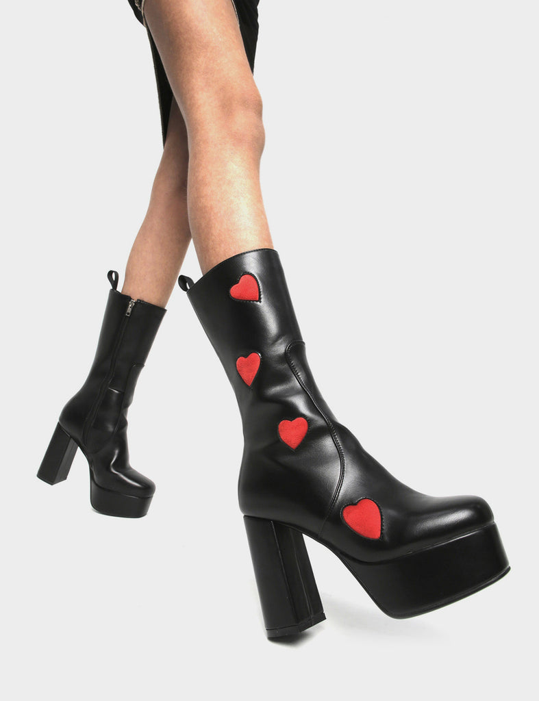 LOVE AT FIRST SIGHT  Game Of Love Platform Calf Boots in Black faux leather. These Black vegan Boots feature our ICONIC Red faux suede hearts and Platform sole and heel, perfect for adding height and style to any outfit. Made with eco-friendly materials and 100% cruelty-free, these boots are as ethical as they are cute!   - Platform Height: 1.25 inch - Heel Height: 4.2 inch - Calf High length - Red Hearts - Black zipper - Platform sole - Round Toe - 100% vegan  SKU: LMF 1213 - BlackPU/RedHeart