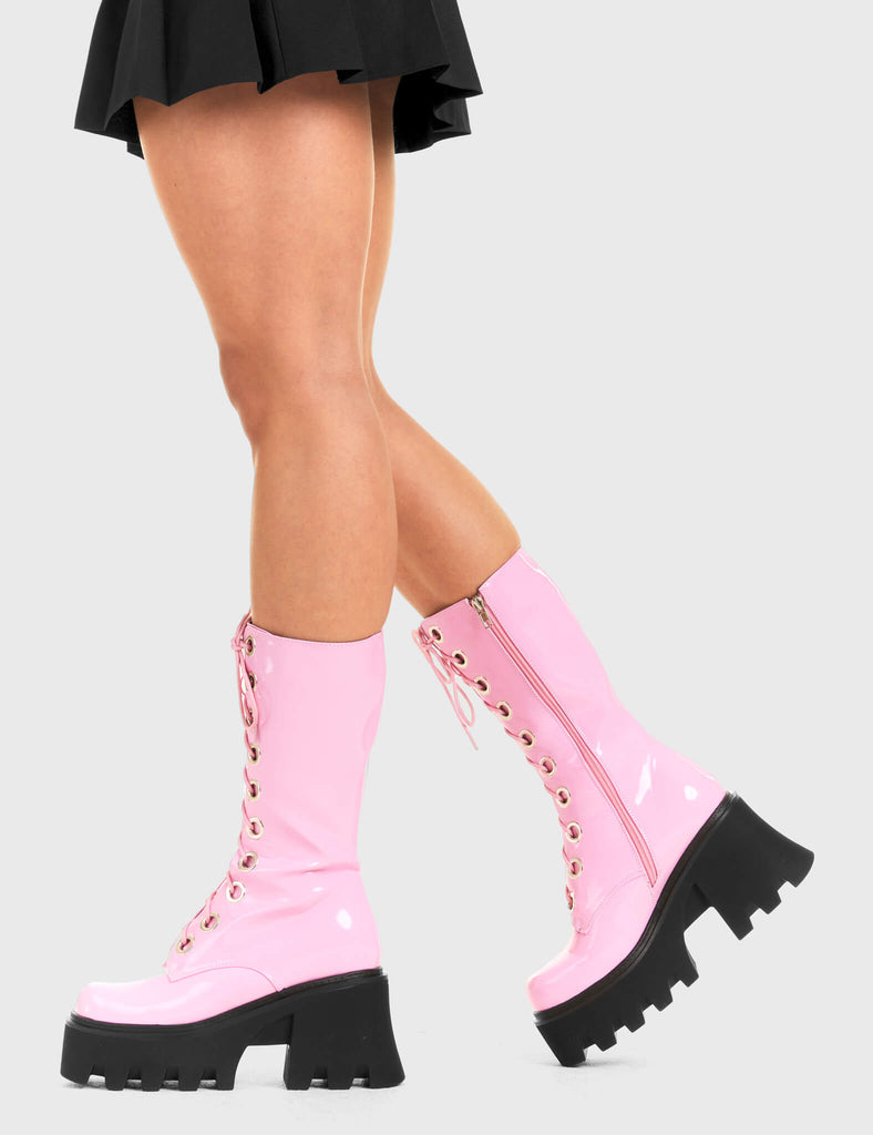 THESE BOOTS ARE MADE FOR WALKING Get Paid Chunky Platform Calf Boots in Pink patent. These vegan western Boots feature a pink lace up boot with silver round eyelets , very classy. Made with eco-friendly materials and 100% cruelty-free, these boots are as ethical as they are edgy! - Chunky Platform - Calf length - Lace up - Silver round eyelets - Rounded toe - 100% vegan SKU: LMF 3605 - PinkPAT