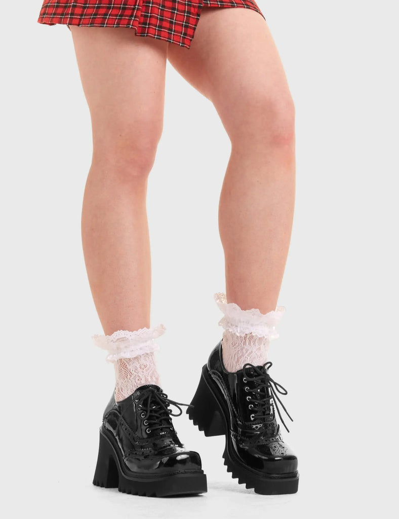 KEEPING IT CHIC Good Evening Chunky Brogue Shoes in Black patent. These vegan western Boots feature a Black Brogue pattern and a shark teeth grip sole, very classy. Made with eco-friendly materials and 100% cruelty-free, these boots are as ethical as they are edgy! - Chunky Platform - Ankle length - Shark teeth grip - Black Brogue pattern - Rounded toe - 100% vegan SKU: LMF 3726 - BlackPAT