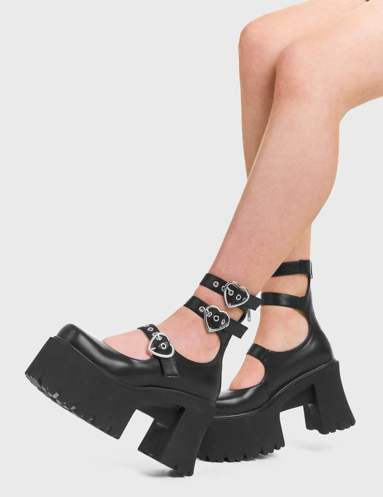 GO AWAY Good Riddance Chunky Platform Ankle Boots in Black faux leather. These vegan Boots feature a minimalist design with three adjustable straps, and heart shaped silver buckles, alongside silver eyelets. Very chic and made with eco-friendly materials and 100% cruelty-free, these boots are as ethical as they are cute!- Platformed- Ankle length- Three adjustable straps - Silver heart shaped buckles- Chunky platform sole- Rounded toe - 100% vegan SKU: LMF 3947 - BlackPU