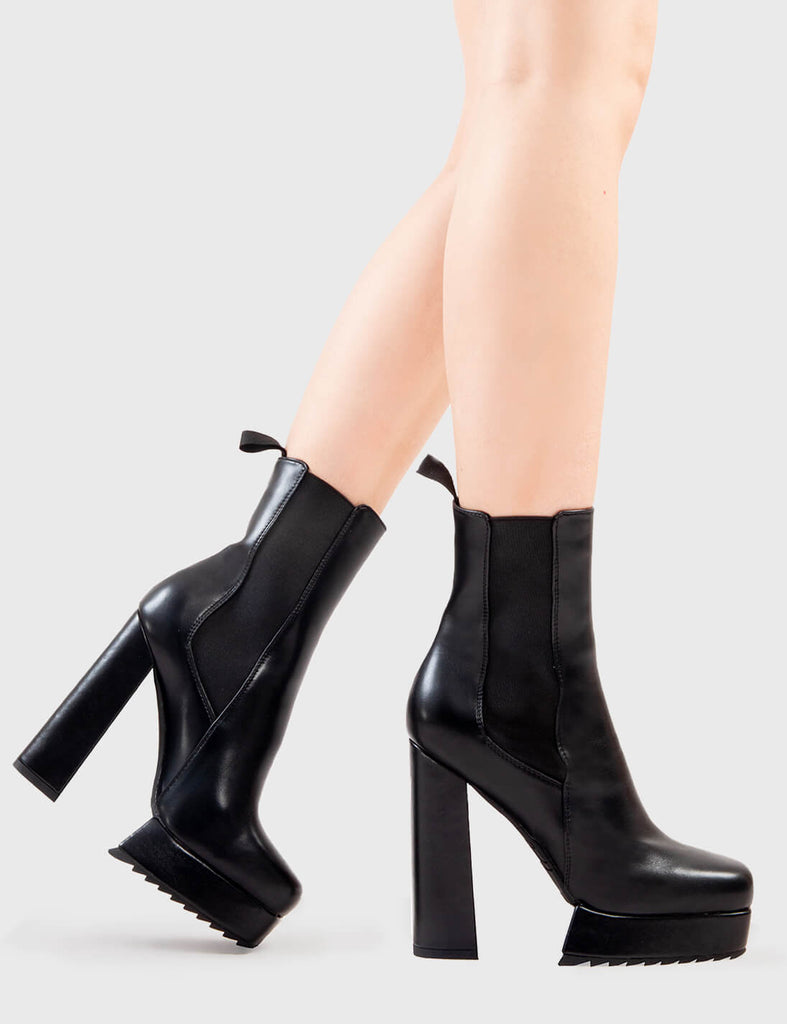 Better Than Basic Hackers Platform Ankle Boots in Black faux leather. These platform boots feature a minimalist design with a stretchy gusset and pull tag, the perfect boots with any outfit. Made with eco-friendly materials and 100% cruelty-free, these platform boots are as ethical as they are Iconic! - Platform Height - Heel Height - Gusset and Pull Tag - Ankle length - Shark's teeth grip - Platform sole - 100% vegan SKU: LMF 2835 - BlackPU