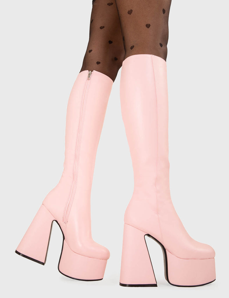 NICE AND SMOOTH Hate You Platform Knee High Boots in Pink faux leather. These platform boots feature a minimalist look with a Flared heel, keeping it nice and classy. Made with eco-friendly materials and 100% cruelty-free, these platform boots are as ethical as they are chic. - Platform Height - Knee high - Flared heel - High Heel - 100% vegan SKU: LMF 3355 - PinkPU
