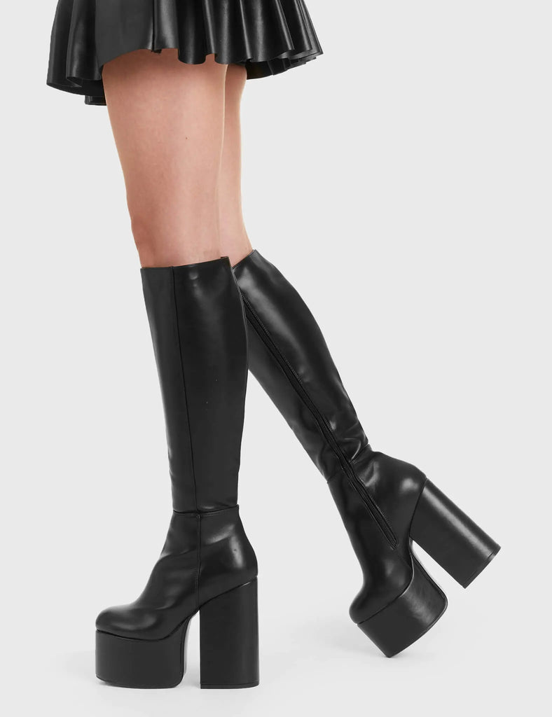 Not Your Basic Boots Heart Vs Head Platform Knee High Boots in Black faux leather. These platform boots feature a minimalist design, perfect with any outfit. Made with eco-friendly materials and 100% cruelty-free, these platform boots are as ethical as they are Perfect! - Platform Height - Heel Height - Black Zipper - Knee length - Platform sole - High Heel - 100% vegan SKU: LMF 2852 - BlackPU