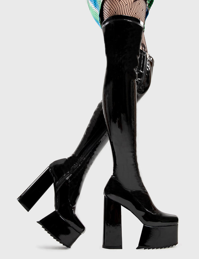 Not Your Basic Boots Late Night Vibes Platform Thigh High Boots Boots in Black Patent. These platform boots feature a minimalist design, with a fitted feel, the perfect pair with any outfit. Made with eco-friendly materials and 100% cruelty-free, these platform boots are as ethical as they are Cool! - Platform Height - Heel Height - Black Zipper - Fitted feel - Thigh length - Platform sole - Shark's teeth grip - High Heel - 100% vegan SKU: LMF 2878 - BlackPAT
