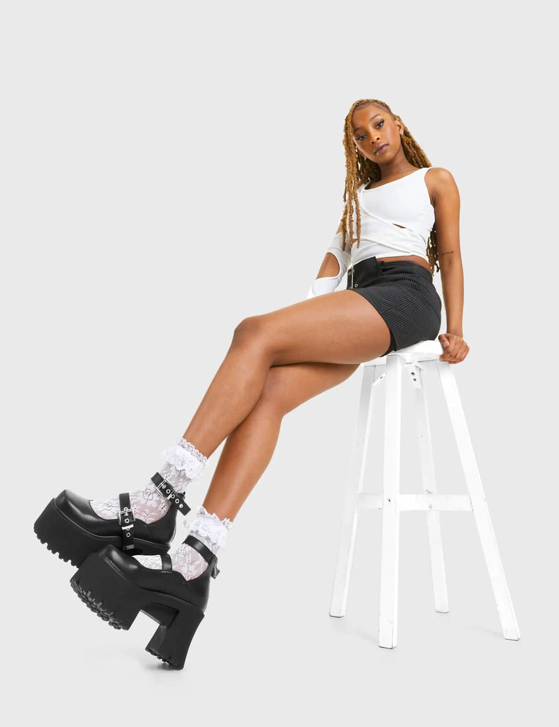 CUTIE PIE Look Away Chunky Platform Shoes in Black faux leather. These vegan western Boots feature a minimalist design with two adjustable straps, very chic. Made with eco-friendly materials and 100% cruelty-free, these boots are as ethical as they are cute! - Platformed - Ankle length - Two adjustable straps - Silver square buckles - Chunky platform sole - Rounded toe - 100% vegan SKU: LMF 3928 - BlackPU