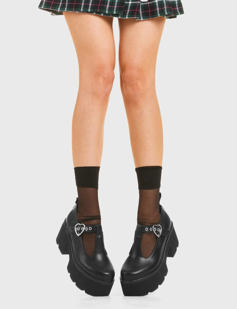 SIMPLY IN LOVE Love Story Chunky Mary Jane Shoes in Black faux leather. These vegan western Boots feature a minimalist design with an adjustable heart buckled straps, very cute. Made with eco-friendly materials and 100% cruelty-free, these boots are as ethical as they are romantic! - Platformed - Ankle length - Silver heart buckle - Chunky black sole - Rounded toe - 100% vegan SKU: LMF 3901 - BlackPU
