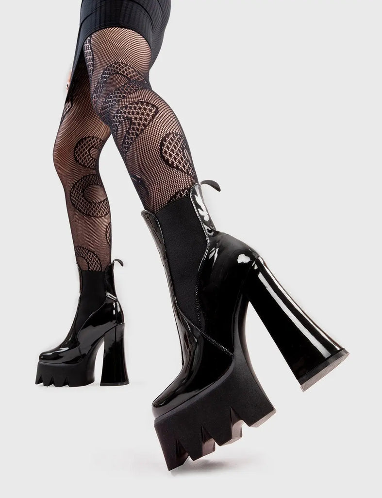 Trend Setter Lumiel Platform Ankle Boots in Black Patent. These platform boots feature a minimalist design with a gusset and pull tag. They are the perfect way to elevate any look. Made with eco-friendly materials and 100% cruelty-free, these platform boots are as ethical as they are Trendy. - Platform Height - Heel Height - Gusset and pull tag - Black Zip - High Heel - Platform Sole - 100% vegan SKU: LMF 2973 - BlackPAT