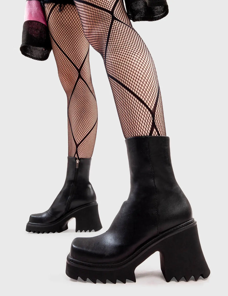 Anything But Basic Old Friend Chunky Platform Ankle Boots in Black faux leather. These platform boots feature an elegant, minimalist design, the perfect way to elevate any outfit. Made with eco-friendly materials and 100% cruelty-free, these platform boots are as ethical as they are cool. - Platform Height - Heel Height - Black Zip - Shark's teeth grip - Chunky Platform sole - 100% vegan SKU: LMF 2910 - BlackPU