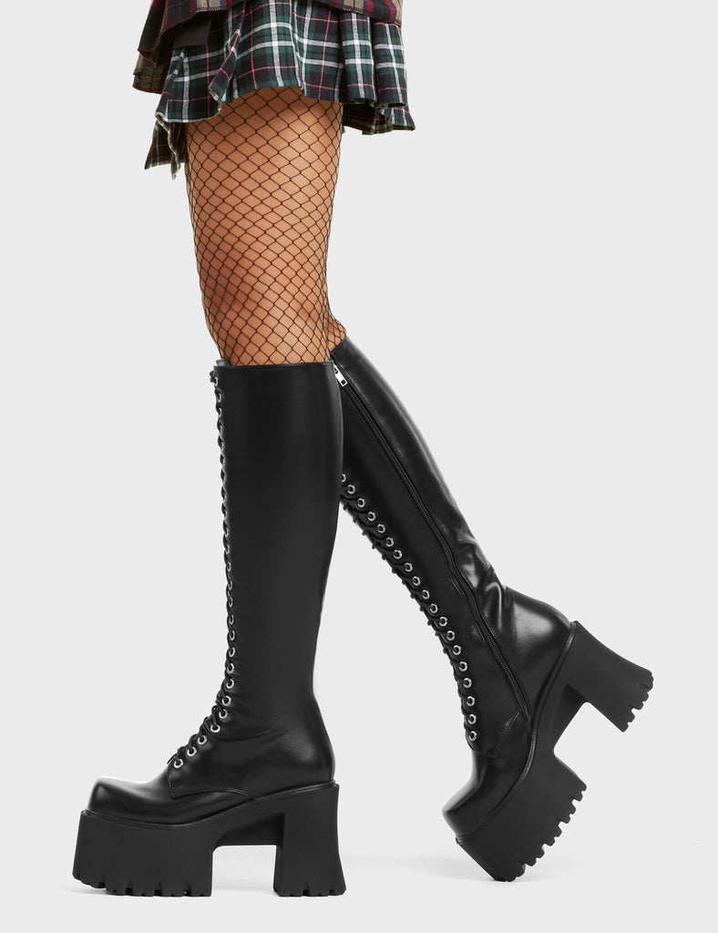 FLOAT LIKE A BUTTERFLY On Ropes Chunky Platform Knee High Boots in Black faux leather. These vegan Boots feature a lace up design and a functional zip. These boots feature our rubber grip on our chunky platform sole. Made with eco-friendly materials and 100% cruelty-free, these boots are as ethical as they are trendy! - Heel Height - Knee High Length - Lace Up Design - Functional Zip - Rubber Grip - Chunky Platform - 100% vegan SKU: LMF 4122 - BlackPU