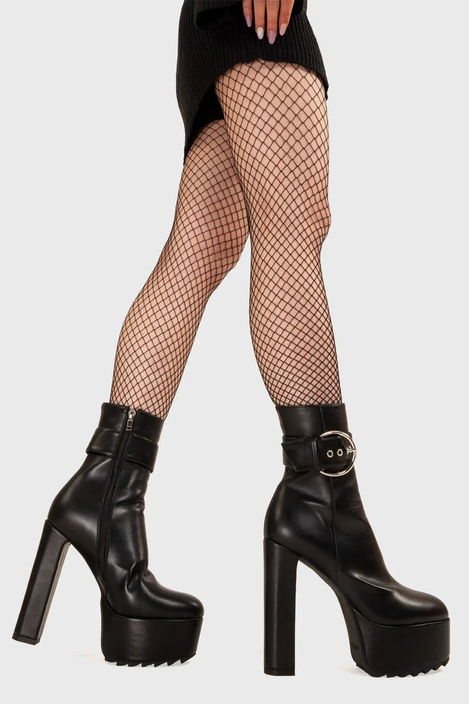 FRESH START Over You Platform Ankle Boots in Black faux leather. These platform boots feature a minimalist look with a zip up eyelets, keeping it nice and classy. features a oversized silver buckles with silver eyelets. Made with eco-friendly materials and 100% cruelty-free, these platform boots are as ethical as they are chic. - Platform Height - Heel Height - Black Zip - Silver Buckle - Silver Eyelets - High Heel - 100% vegan SKU: LMF 3112 - BlackPU