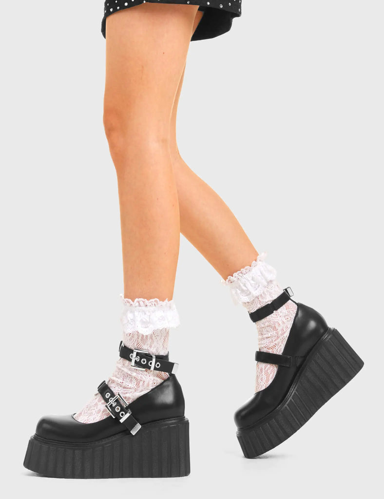 XOXO Persuasive Chunky Platform Creeper Shoes in Black Faux Leather. These vegan western Boots feature metal hearts and two adjustable straps, very classy. Made with eco-friendly materials and 100% cruelty-free, these boots are as ethical as they are edgy! - Chunky Platform - Ankle length - two adjustable straps - Silver buckles - Metal Heart feature - Rounded toe - 100% vegan SKU: LMF 3611 - BlackPU