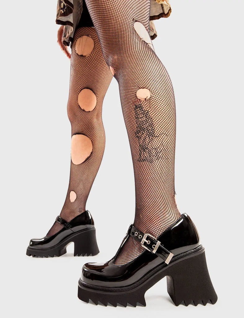 THE SHOEDROBE STAPLE Quiet Storm Chunky Mary Jane Shoes in Black Patent. These Mary Janes feature an adjustable straps with silvery eyelets and a silver buckle, along with a Chunky and comfortable Platform sole. Everyone needs a pairs of Mary Janes! Made with eco-friendly materials and 100% cruelty-free, these are as ethical as they are cute! - Platform Height: - T-bar Structure - Square buckle and silver eyelets - Chunky Platform sole - Round toe - 100% vegan SKU: LMF 2906 - BlackPAT