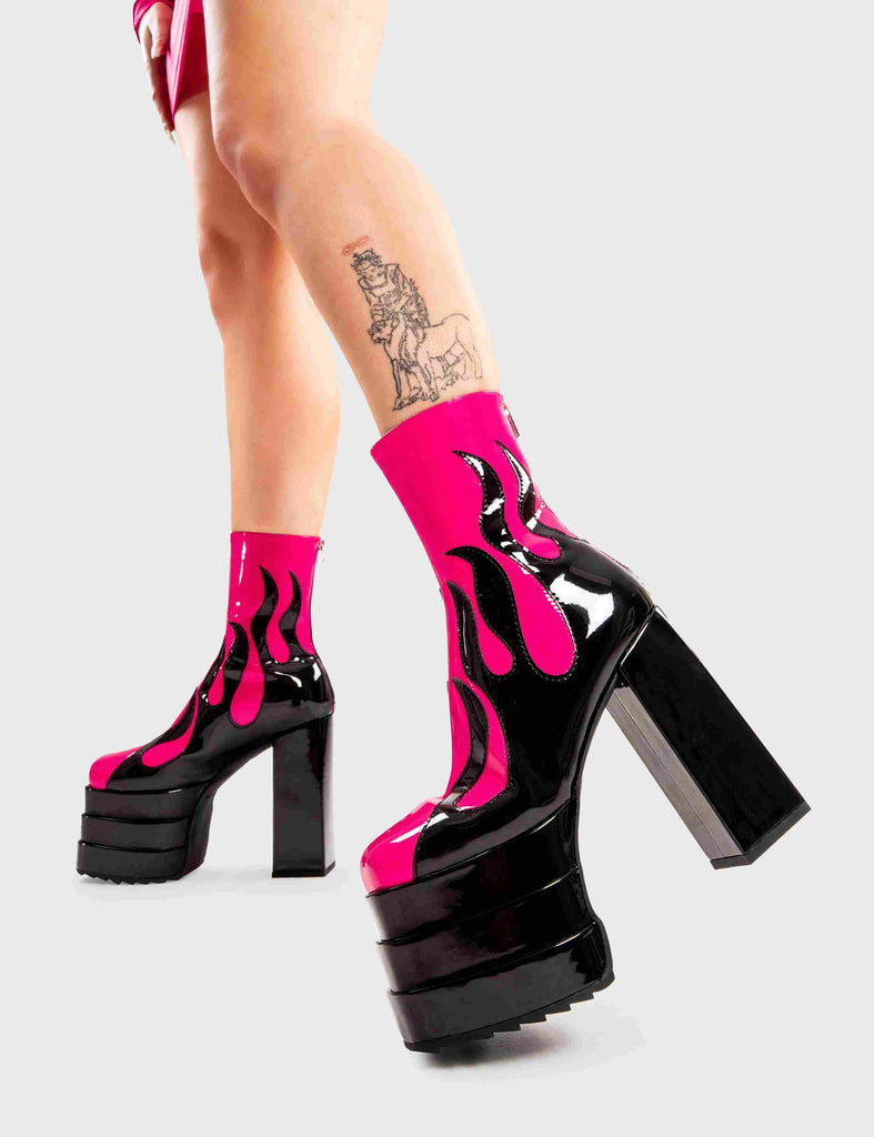 Set Things on Fire Reborn Platform Ankle Boots in Fuchsia faux leather. These platform boots feature a black flame design on our triple stack platform sole. Made with eco-friendly materials and 100% cruelty-free, these platform boots are as ethical as they are Fire. - Platform Height - Heel Height - Black zip - Flame design - High Heel - Triple Stack platform sole - 100% vegan SKU: LMF 2998 - FuchsiaPU/Flame