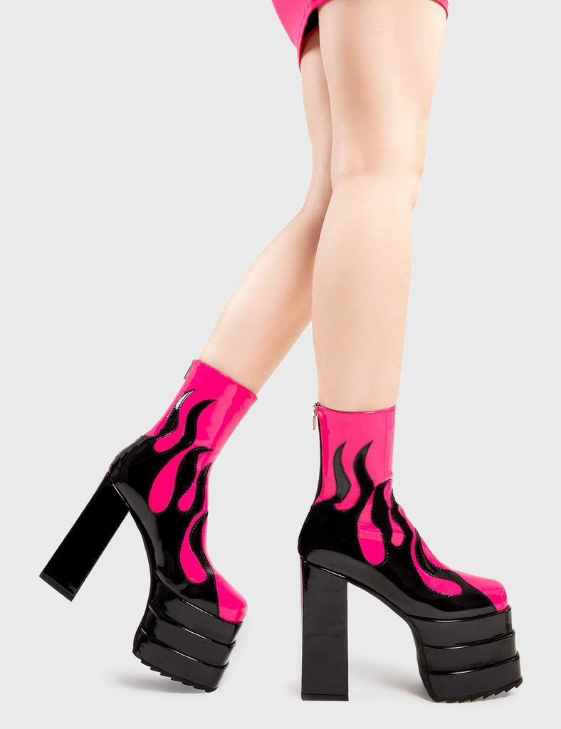 Set Things on Fire Reborn Platform Ankle Boots in Fuchsia faux leather. These platform boots feature a black flame design on our triple stack platform sole. Made with eco-friendly materials and 100% cruelty-free, these platform boots are as ethical as they are Fire. - Platform Height - Heel Height - Black zip - Flame design - High Heel - Triple Stack platform sole - 100% vegan SKU: LMF 2998 - FuchsiaPU/Flame