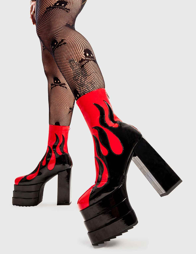 Set Things on Fire Reborn Platform Ankle Boots in Red faux leather. These platform boots feature a black flame design on our triple stack platform sole. Made with eco-friendly materials and 100% cruelty-free, these platform boots are as ethical as they are Fire. - Platform Height - Heel Height - Black zip - Flame design - High Heel - Triple Stack platform sole - 100% vegan SKU: LMF 2998 - RedPU/Flame
