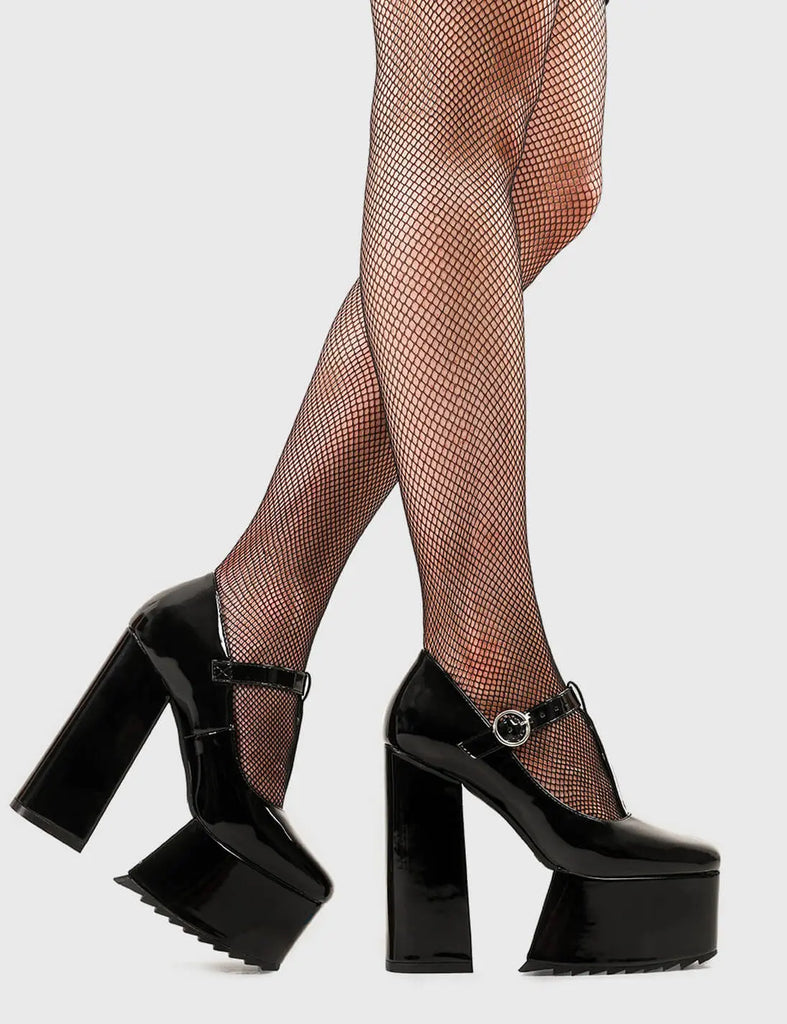 Girl Boss Era Redemption Platform Heels in Black Patent faux leather. These heels feature a T Bar structure with a adjustable ankle strap, keep your attitude as high as your platforms. Made with eco-friendly materials and 100% cruelty-free, these platform boots are as ethical as they are Hot! - Platform Height - Heel Height - T Bar structure - Adjustable ankle strap - Silver eyelets and 'O' ring shaped buckles - Shark's teeth grip - Platform sole - Round Toe - 100% vegan SKU: LMF 2685 - BlackPAT