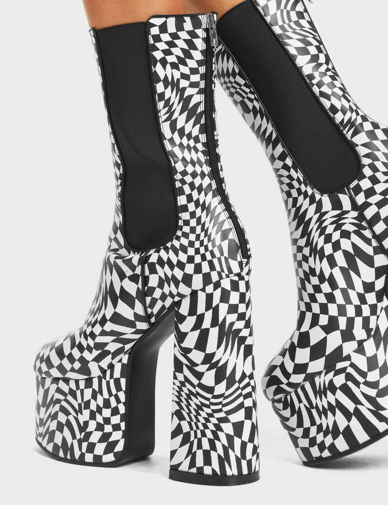 Scorpio Platform Ankle Boots in Black and White faux leather. These platform boots feature a black and white check design on a high platform sole. Made with eco-friendly materials and 100% cruelty-free!