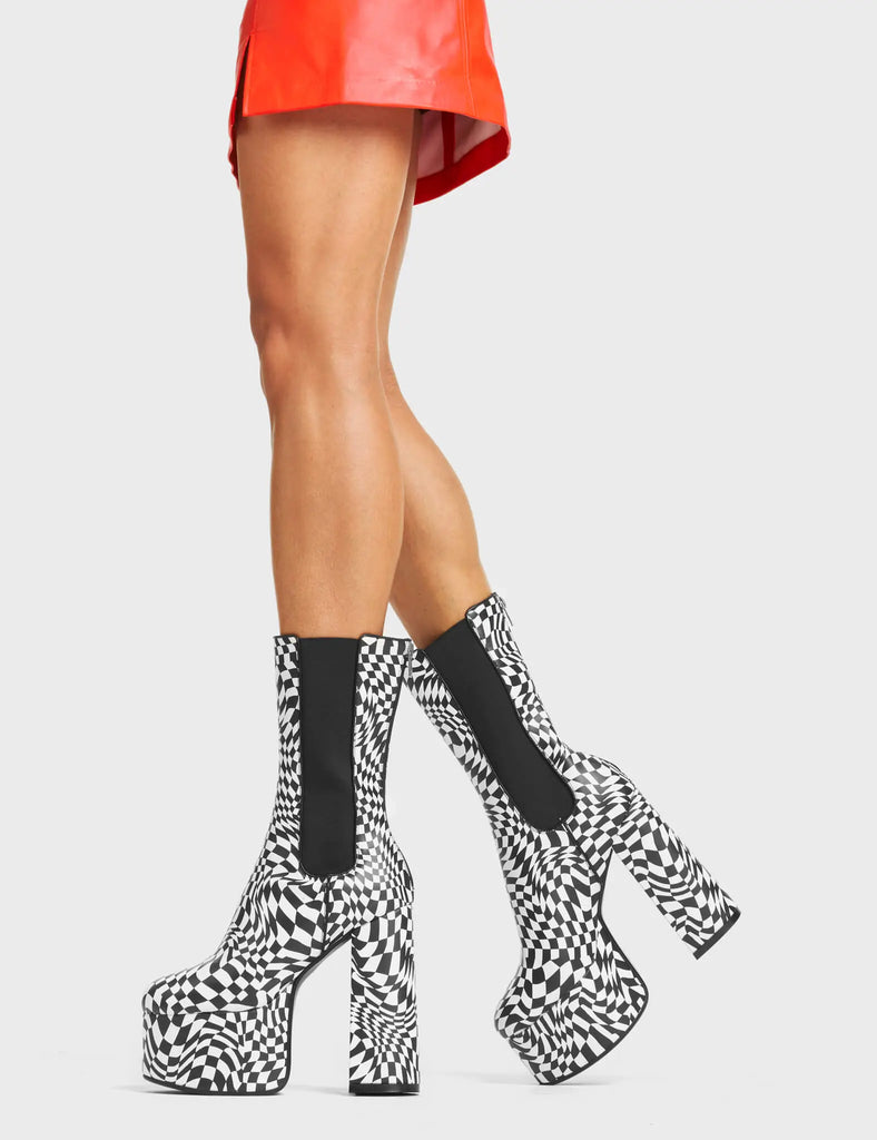 Scorpio Platform Ankle Boots in Black and White faux leather. These platform boots feature a black and white check design on a high platform sole. Made with eco-friendly materials and 100% cruelty-free!