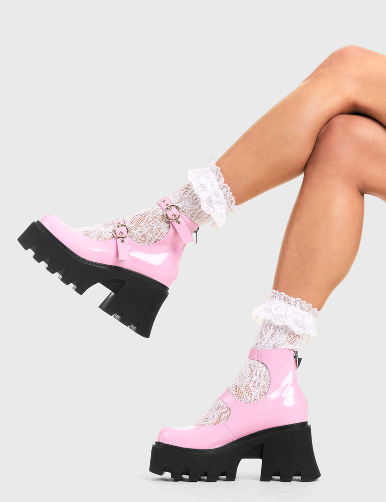 BUCKLED UP Slow Jamz Chunky Platform Ankle Boots in pink patent. These platform boots feature two adjustable straps with silver buckles and eyelets. Made with eco-friendly materials and 100% cruelty-free, these platform boots are as ethical as they are chic. - Platform Height - Ankle length - Two adjustable straps - Silver buckles and eyelets - Rounded toe - High Heel - 100% vegan SKU: LMF 3600 - PinkPAT