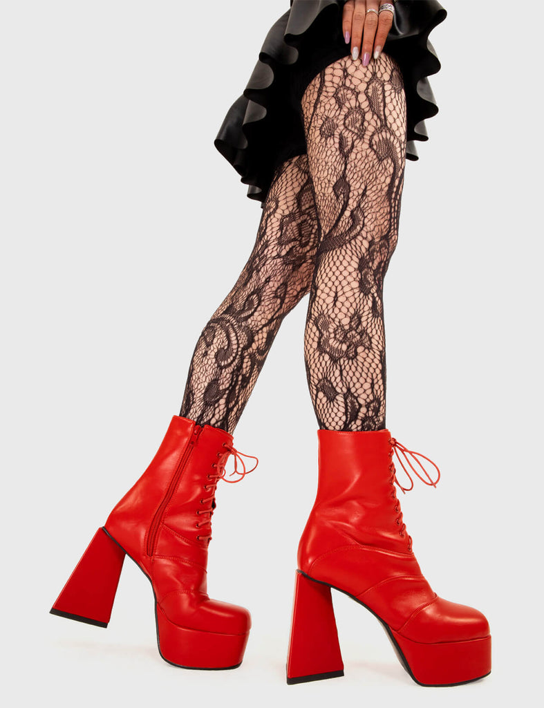 KEEP IT SMOOTH Strollin' Platform Ankle Boots in Red faux leather. These platform boots feature a minimalist look with a triangle heel, keeping it nice and classy. Made with eco-friendly materials and 100% cruelty-free, these platform boots are as ethical as they are chic. - Platform Height - Ankle length - Lace up - Triangle heel - High Heel - 100% vegan SKU: LMF 3331 - RedPU