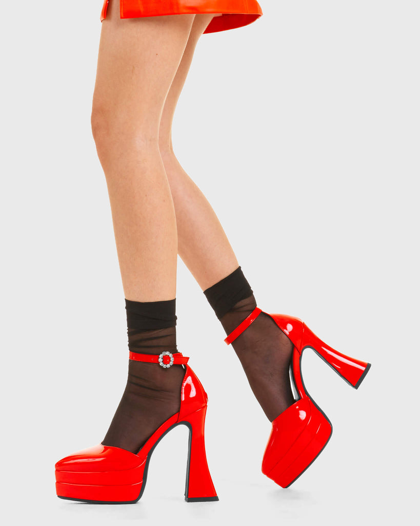 CATWALK READY Tear of Joy Platform Heels in Red patent. These platform boots feature a minimalist look with a flared heel, keeping it nice and classy. Made with eco-friendly materials and 100% cruelty-free, these platform boots are as ethical as they are chic. - Platform Height - Adjustable strap - Flared heel - Pointed toe - High Heel - 100% vegan SKU: LMF 3525 - RedPAT