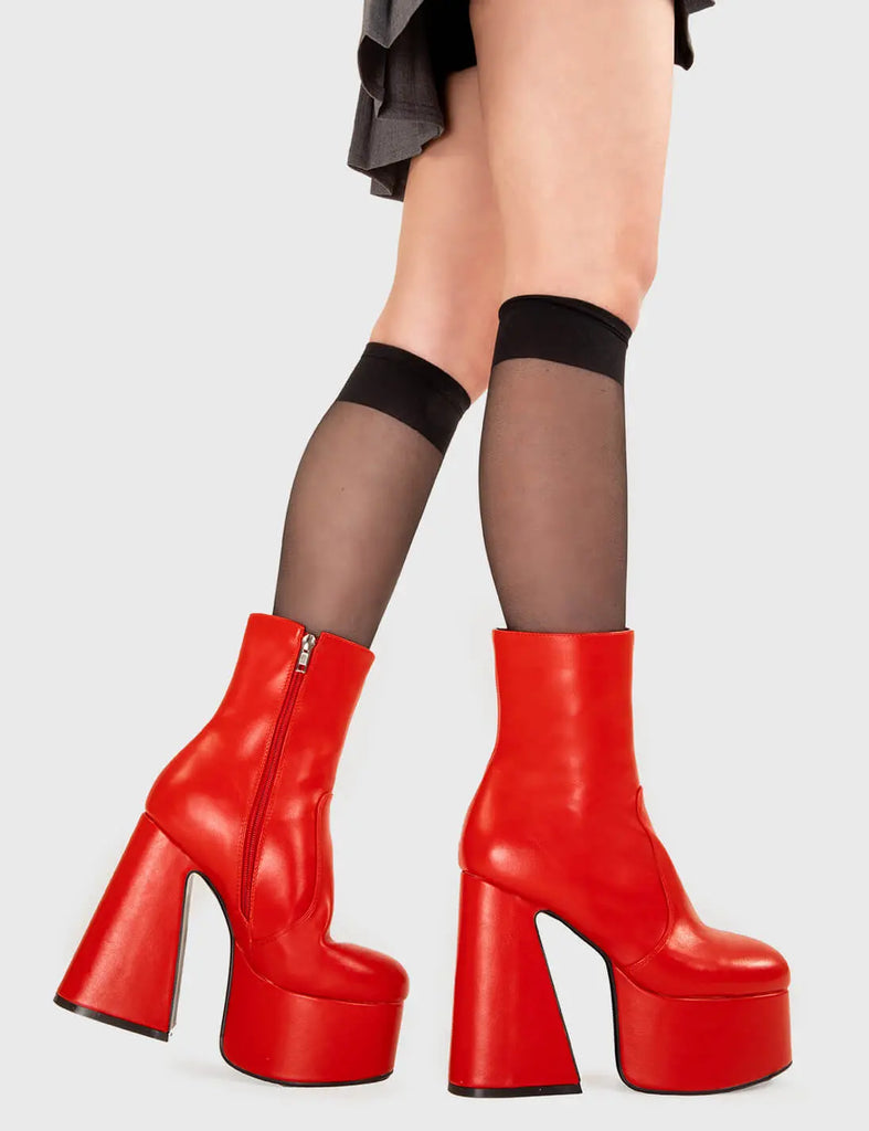 SMOOTH LIKE BUTTER Under Cover Platform Ankle Boots in Red faux leather. These platform boots feature a minimalist look with a flared heel, keeping it nice and classy. Made with eco-friendly materials and 100% cruelty-free, these platform boots are as ethical as they are chic. - Platform Height - Ankle length - Flared heel - High Heel - 100% vegan SKU: LMF 3349 - RedPU