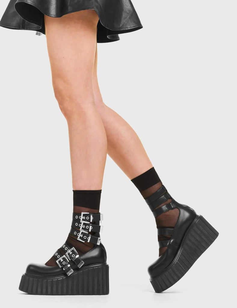 BUCKLED UP Under The Influence Chunky Platform Creeper Shoes in Black Faux Leather. These vegan western Boots feature silver buckles and five adjustable straps, very classy. Made with eco-friendly materials and 100% cruelty-free, these boots are as ethical as they are edgy! - Chunky Platform - Ankle length - Five adjustable straps - Silver buckles - Silver eyelets - Rounded toe - 100% vegan SKU: LMF 3616 - BlackPU